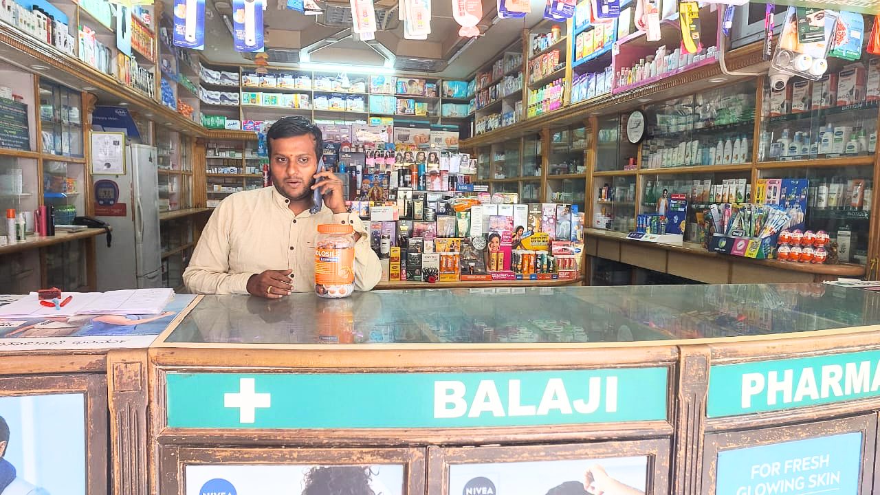 A retail pharmacy counter stocked with health and wellness products
